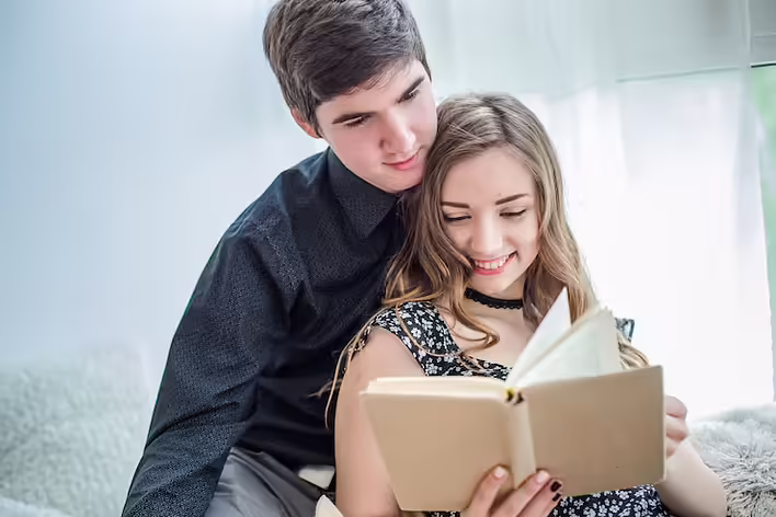 beautiful-girl-smiles-happily-reading-book-offline-library-foreign-students-are-preparing-exams_153527-316.jpeg